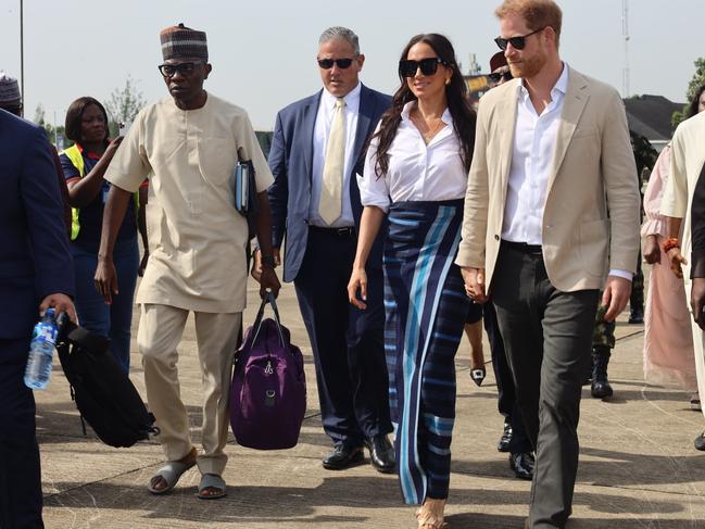 Dressed in navy and wearing a red kufi hat, Onyema was one of a small group of dignitaries, which included senior military and government officials, photographed alongside the Sussexes as they deboarded their Air Peace aircraft X/@flyairpeace