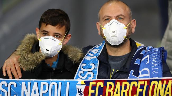 Fans wear medical masks at the Napoli v Barcelona Champions League clash.