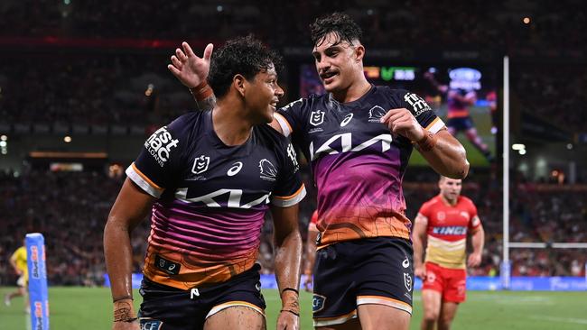 BRISBANE, AUSTRALIA - MARCH 24: Selwyn Cobbo (L) of the Broncos celebrates scoring a try with Kotoni Staggs during the round four NRL match between the Dolphins and Brisbane Broncos at Suncorp Stadium on March 24, 2023 in Brisbane, Australia. (Photo by Bradley Kanaris/Getty Images)