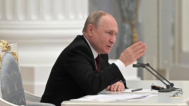 Russian President Vladimir Putin chairs a meeting with members of the Security Council in Moscow on Tuesday (AEST). AFP)