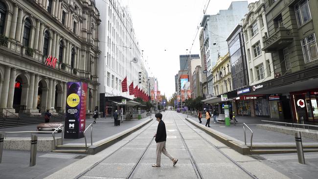 Bourke Street Mall almost empty during the morning peak on the first day of lockdown. Picture: NCA NewsWire / Andrew Henshaw