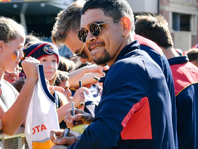 Charlie Cameron signing autographs for Crows fans after their Grand Final loss. Picture: AAP