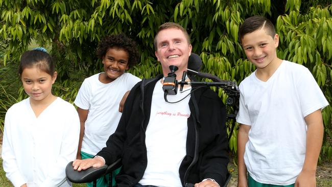 Perry Cross spoke to students at Musgrave Hill State School. Perry Cross with Darnna Allen (8), Joseph Koi (8) and Seth Nikotemo (10).