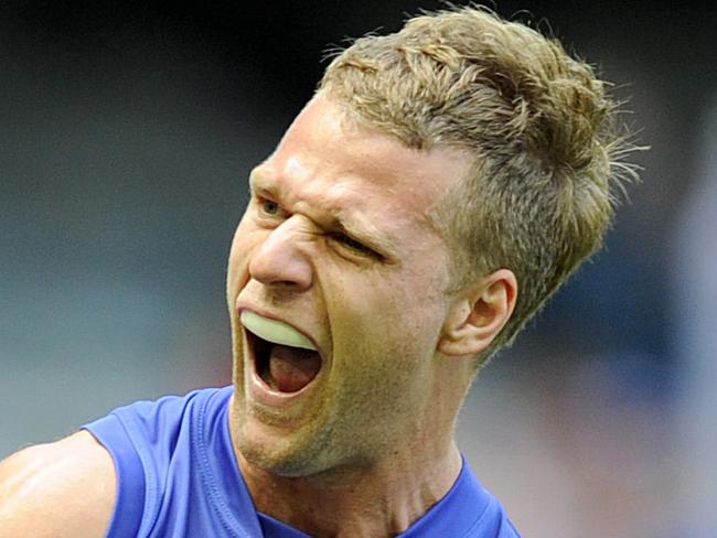 Jake Stringer of the Western Bulldogs celebrates after kicking a goal, during the round one AFL match between the Western Bulldogs and Fremantle Dockers, at the Etihad Stadium in Melbourne, Sunday, March 27, 2016. (AAP Image/Joe Castro) NO ARCHIVING, EDITORIAL USE ONLY