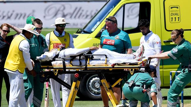 Bangladesh's Mushfiqur Rahim is carried away by ambulance staff after being hit in the head at Basin Reserve.