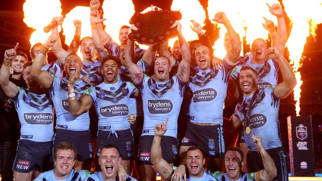 Boyd Cordner of the Blues and teammates celebrate with the State of Origin trophy after winning the series and winning game three of the 2019 State of Origin series. Picture: Cameron Spencer/Getty Images