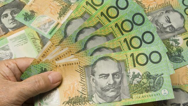 A Hand fanning out 500 Australian dollars. Australian money cash generic