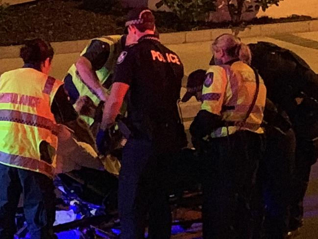 Police, ambulance staff attend to the aftermath of a driver crashing a rental car after turning off Enderley Avenue, Surfers Paradise, on the Esplanade on Saturday night, December 21, 2019. Picture: Gold Coast Bulletin