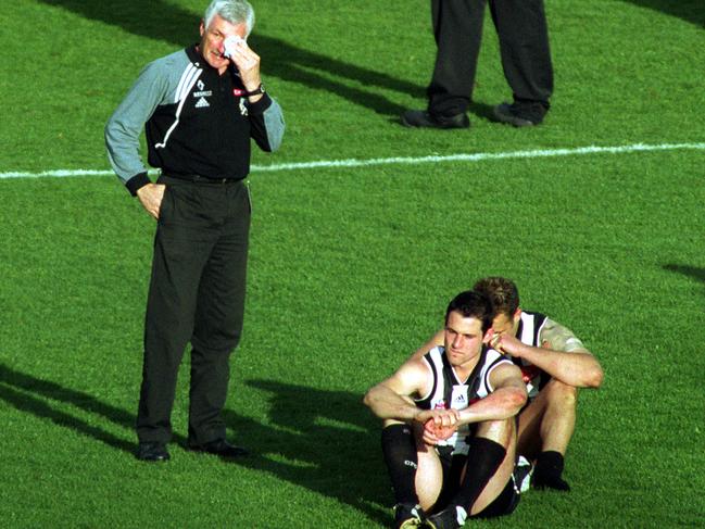 An emotional Mick Malthouse and Alan Didak after their 2002 Grand Final loss. Picture: Joe Mann