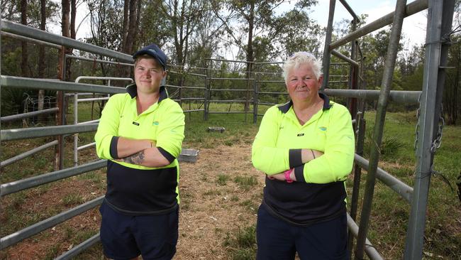 Beth and Sharon in the holding yards built to pen the cattle. Picture: Robert Pozo