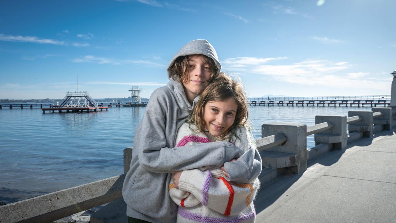 Paz, 12, and Queenie, 9, brave the cold morning at Eastern Beach in Geelong. Picture: Brad Fleet