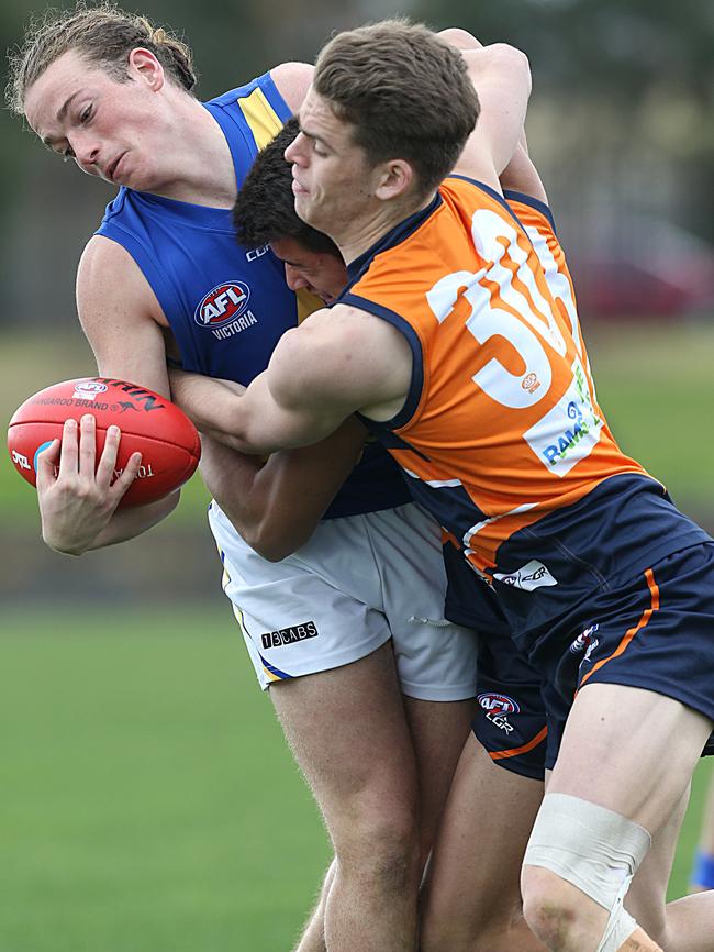 Mitch Podhajski wraps up Western Jets Luke Hitch in a tackle. Picture: Ian Currie.