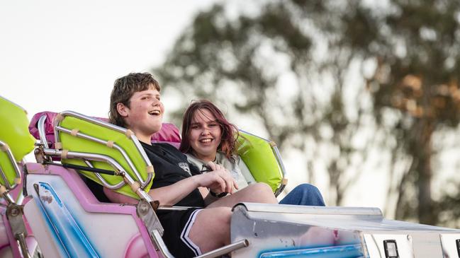 Siblings Jayden and Ally Halter ride the Cyber Dance Cafe at the Toowoomba Royal Show, Thursday, March 30, 2023. Picture: Kevin Farmer