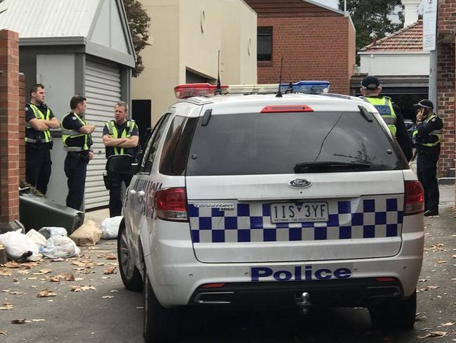 Police outside the four-star rental this morning. Picture: Paul Dowsley