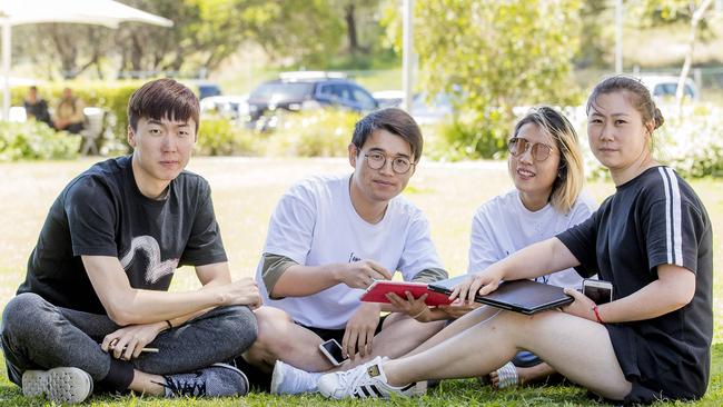 For Sze Chun Li, Shi Ren, Yuyan Liang and Fei Zhao the relaxed atmosphere was the real draw to study on the Gold Coast. Picture: Jerad Williams