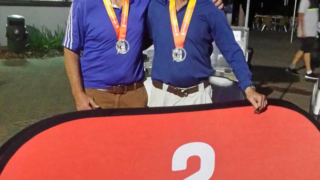 SILVER SMILES: Kim McCasker and Greg Wallace after winning a silver medal in the Pan Pacific Masters Games  on the Gold Coast. Picture: Contributed