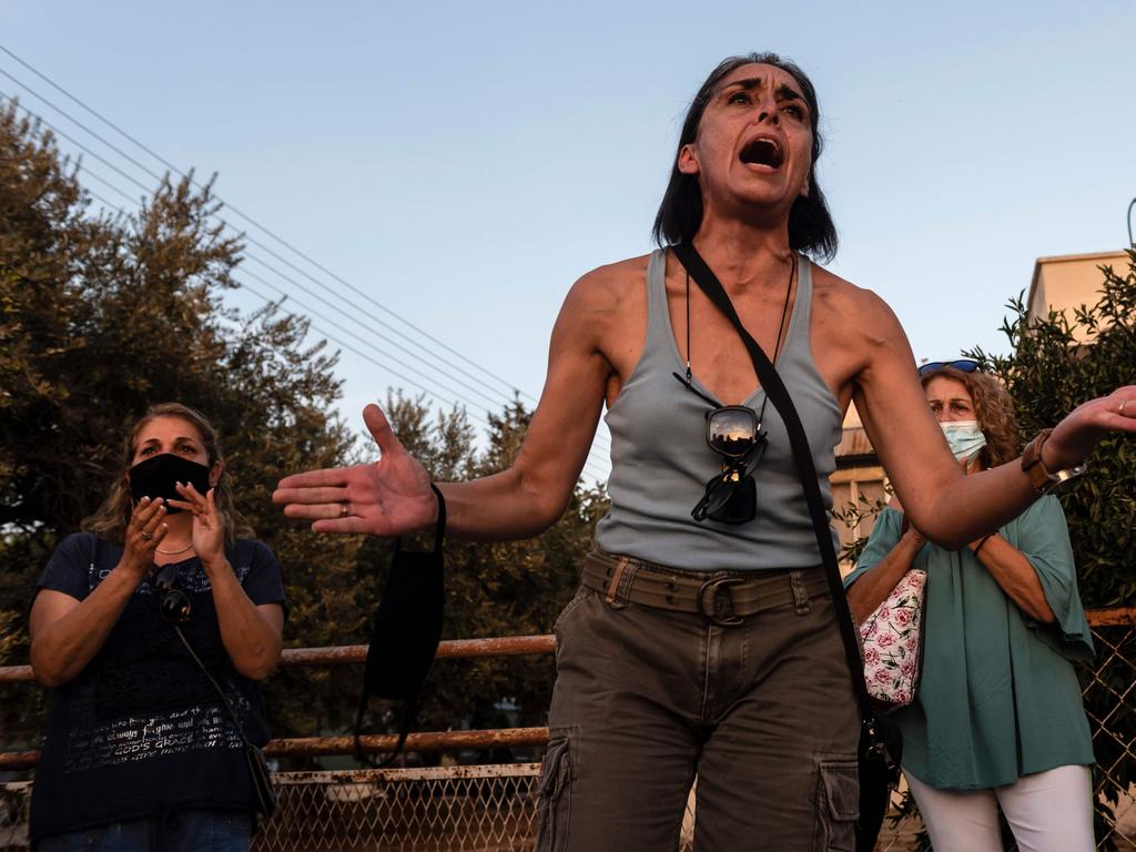 A Greek Cypriot woman takes part in a protest at the Deryneia crossing point as Varosha is opened. Picture: Iakovos Hatzistavrou / AFP