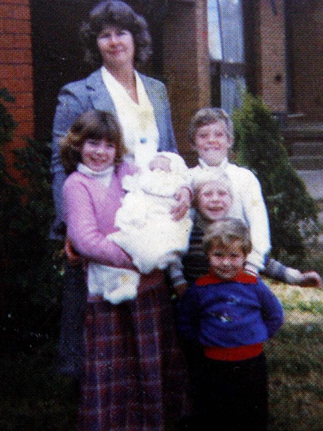 A family photo from Mick Fanning’s book Surf For Your Life. "Family photo in front of our house in Penrith. Rachel is holding me, while Sean, Edward and Peter are nicely lined up in front of Mum". Picture: Mark Evans