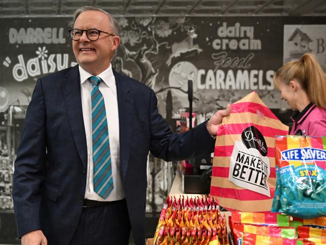 Prime MInister Anthony Albanese purchases some treats during a visit to the Darrell Lea confectionary factory in Ingleburn, Sydney, Wednesday, November 1, 2023. (AAP Image/Dean Lewins/POOL) NO ARCHIVING