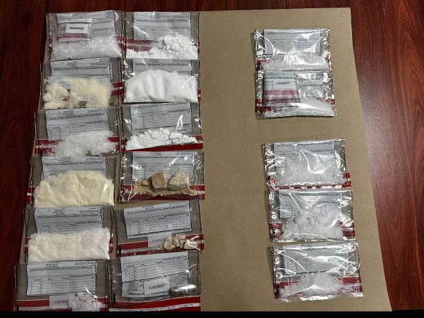 Two people charged with trafficking after police seized more than half a kilo of ice and $100k in cash in a targeted operation. Image: Tasmania Police