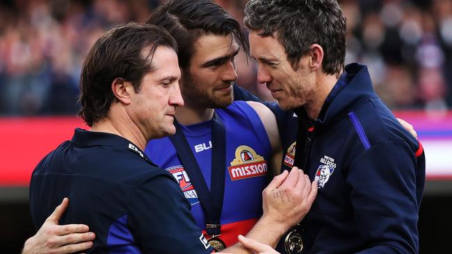 Luke Beveridge presents his premiership medal to Bob Murphy. Picture: Phil Hillyard