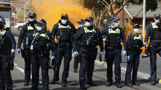 Police face off against protesters on Bridge Rd. Picture: Alex Coppel