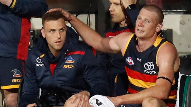 Smith and former Crows ruckman Sam Jacobs after the former injured his knee against the Giants and missed the grand final a few weeks later. Picture: Michael Willson/AFL Media/Getty Images