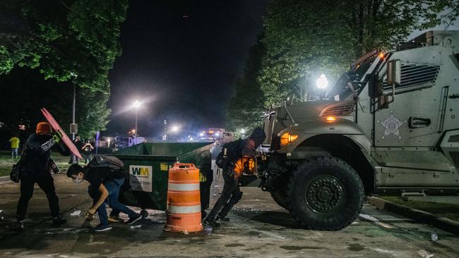 Demonstrators attempt to block an armored police vehicle on August 25, 2020 in Kenosha, Wisconsin. Picture: Brandon Bell/Getty Images/AFP