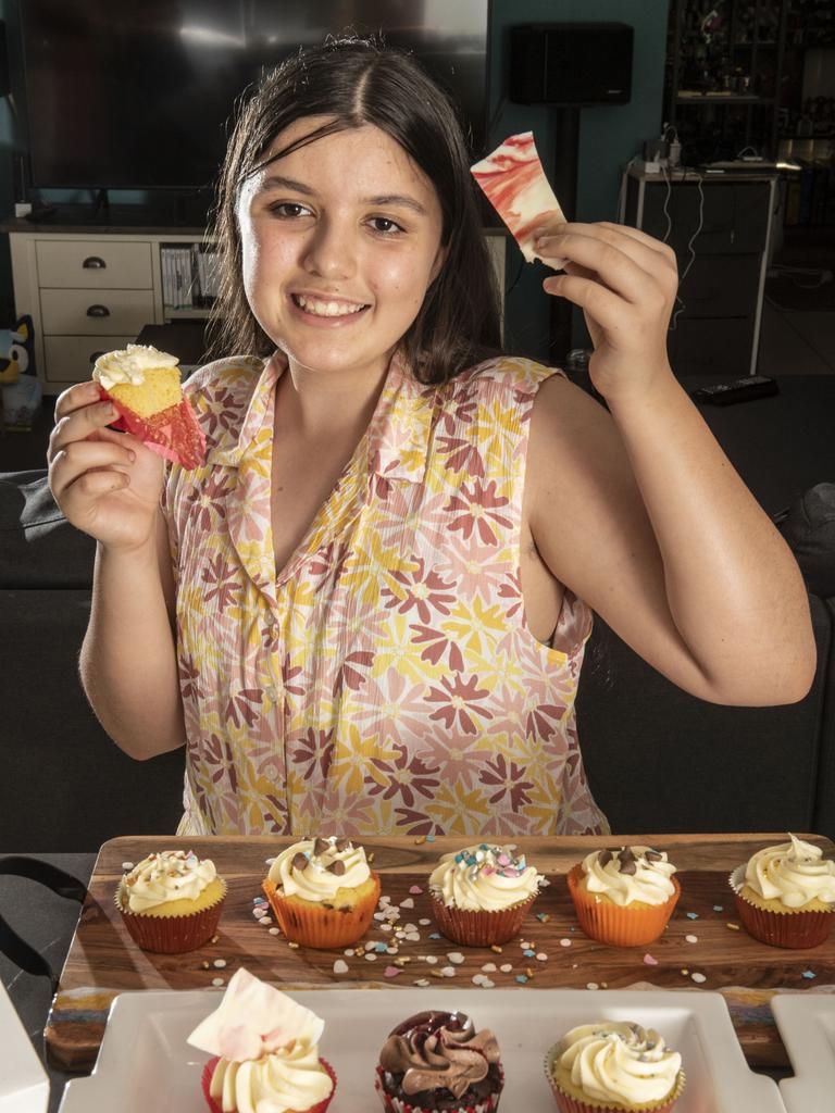 Katherine Preston makes yummy cupcakes for sale at the Cabarlah markets. Wednesday, November 10, 2021. Picture: Nev Madsen.