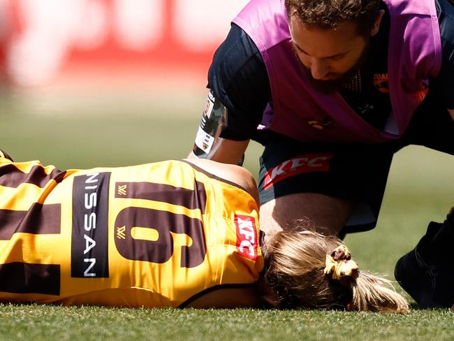 MELBOURNE, AUSTRALIA - NOVEMBER 10: Ainslie Kemp of the Hawks is attended to by trainers during the 2024 AFLW Second Qualifying Final match between the Hawthorn Hawks and the Brisbane Lions at IKON Park on November 10, 2024 in Melbourne, Australia. (Photo by Michael Willson/AFL Photos via Getty Images)