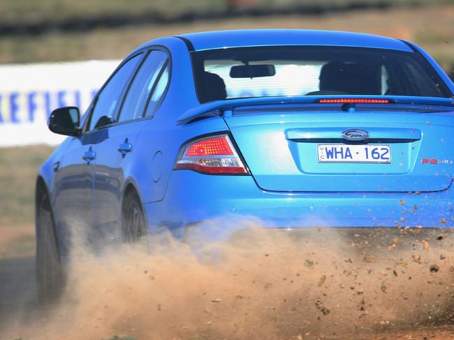 Steve Pizzati and Charlie Cox take Ford Falcon and Holden Commodore head-to-head in The Ultimate Drive in Davenport, Tasmania, 02/09/2008, in an episode of TV show 'Top Gear Australia'. Pic Sabine Albers/BBC Worldwide.