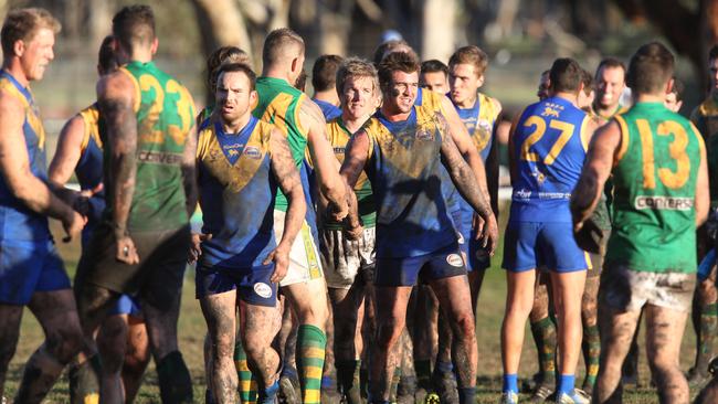 Deer Park and Spotswood players shake hands after their Round 5 match earlier this year. The two teams will battle it out in a big WRFL clash again this weekend. Photo: Mark Wilson