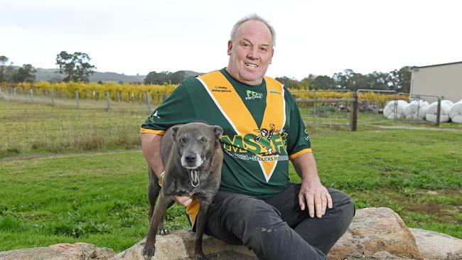 Gary Humphrys has been a volunteer with Myponga-Sellicks Football Club since the 1980s. He’s pictured with his dog, Buddy, at his Myponga home. Picture: Tom Huntley