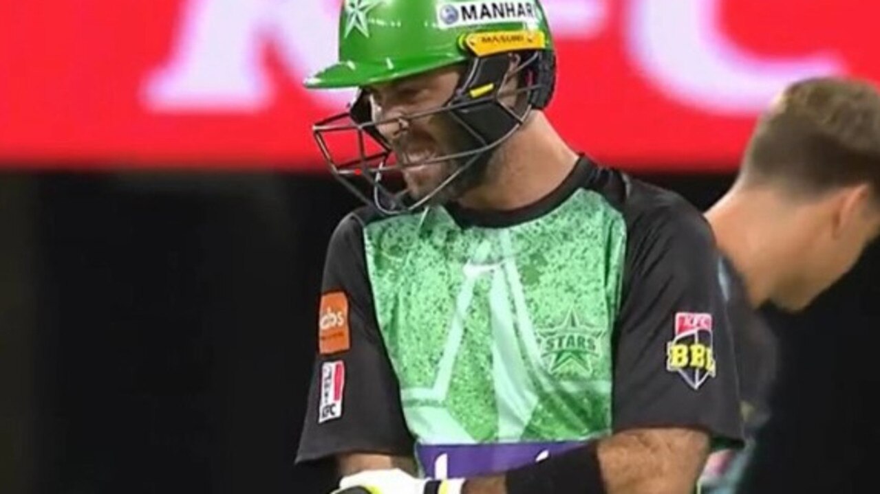 Glenn Maxwell grabs at his forearm.