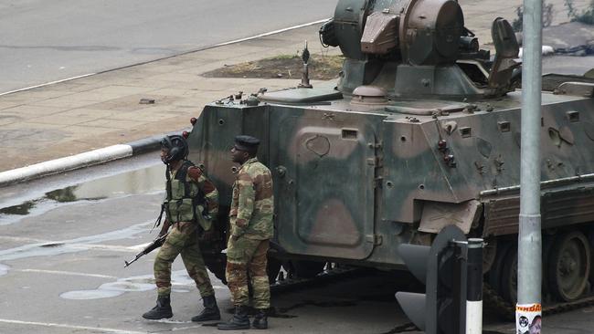 Soldiers and a tank guard the road leading to President Robert Mugabe's office in Harare, Zimbabwe.   Picture: AP