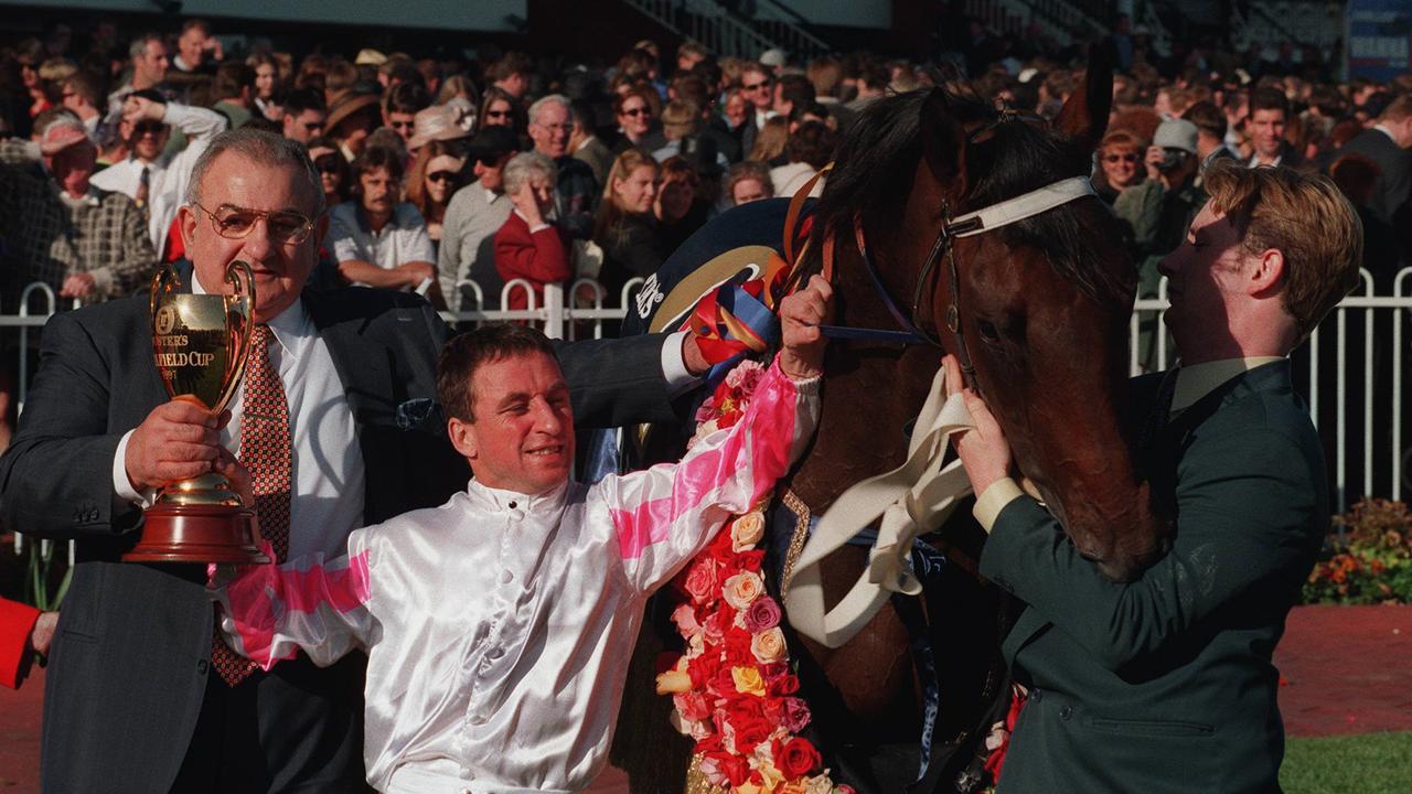 Caulfield Cup Presentation . owner Nick Moraitis, jockey Jim Cassidy and racehorse Might And Power after winning the Caulfield Cup. p/. 18 Oct 1997. /racing sport horseracing trophy celebrating