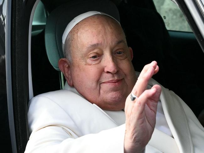 (FILES) Pope Francis arrives to celebrate the mass for the Jubilee of the Armed Forces at St. Peter's square in the Vatican on February 9, 2025. Pope Francis was admitted to hospital in Rome on February 14, 2025 for tests and treatment for ongoing bronchitis, the Vatican announced. (Photo by Alberto PIZZOLI / AFP)