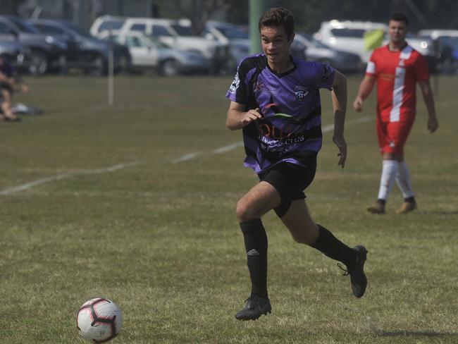 Grafton's Joshie Paterson come down the wing in the Men's Division 2 North grand final between Grafton United Sirens and Majos FC White at Yamba on Saturday.