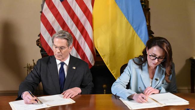 US Treasury Secretary Scott Bessent and Ukraine's Deputy Prime Minister Yulia Svyrydenko sign the minerals deal in Washington. Picture: Handout/AFP