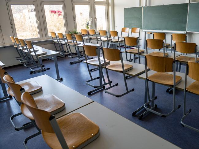 A picture taken on March 13, 2020 shows an empty classroom at a high school in Halle/Saale, eastern Germany, after it was closed to limit the spread of the novel coronavirus. - With Germany reporting increasing COVID-19 cases reaching 2,369 including five deaths on March 12, 2020, German government has ramped up its response. The regional governments of Germany's 16 states will decide if they want to shutter school gates according to the local situation, Chancellor Angela Merkel said, adding that an option could be to bring forward April's Easter school holidays. (Photo by JENS SCHLUETER / AFP)