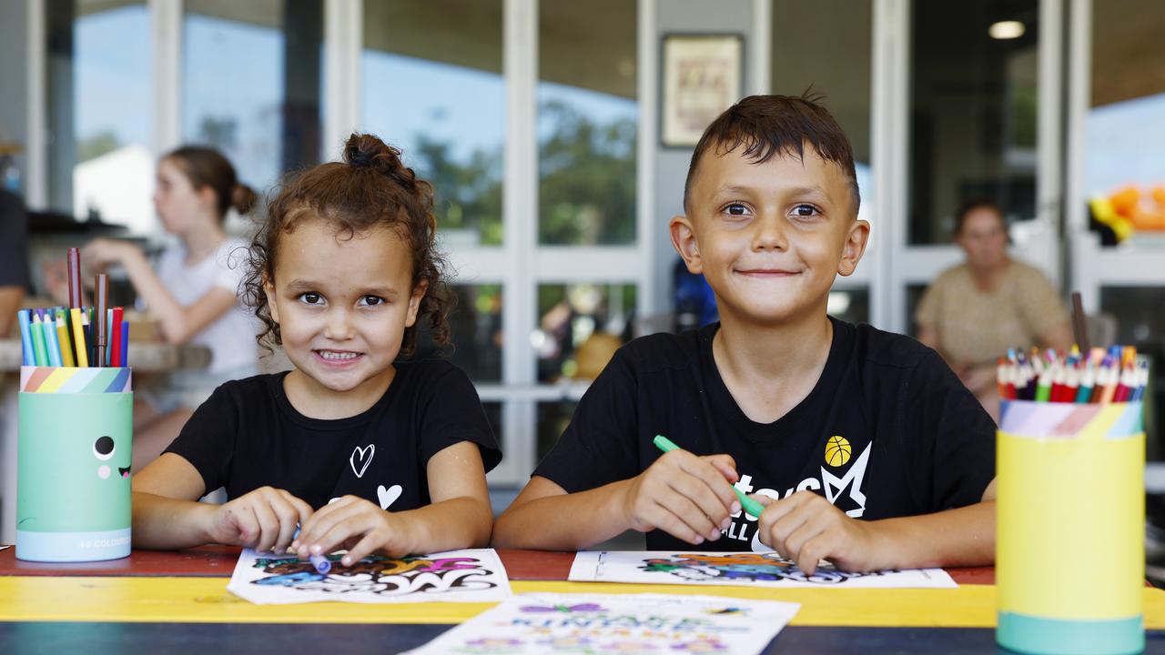 Kamari Brim, 4, and Kaiyu Brim, 8, at the Little Day Out family day, held at the Holloways Beach Sports Oval and raising funds for the Holloways Hub. Picture: Brendan Radke