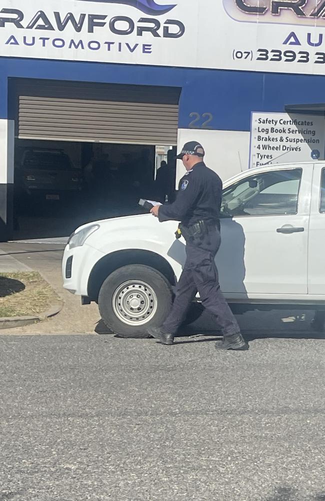 Emergency crews on scene at Wynnum workplace after a fall from a roof. Picture: Brayden Heslehurst