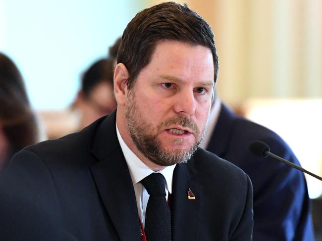 Director-General of the Department of Innovation, Tourism Industry Development and the Commonwealth Games, Damien Walker,  answers questions during a budget estimates committee hearing at Parliament House in Brisbane, Wednesday, August 1, 2018. (AAP Image/Dan Peled) NO ARCHIVING