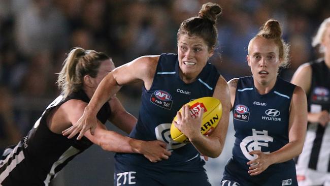 Bri Davey tries to break a tackle against Collingwood. Picture: Wayne Ludbey