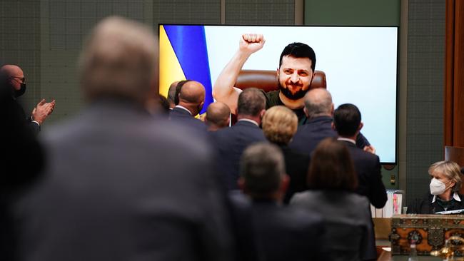 Ukrainian President Volodymyr Zelensky salutes the Australian parliament after his historic videolink address on Thursday. Picture: Adam Taylor