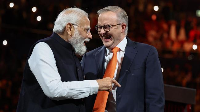 Indian Prime Minister Narendra Modi shares a lighter moment with Anthony Albanese on Tuesday. Picture: AFP