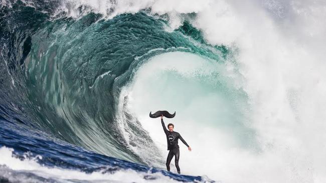 Pic of Shaun Wallbank surfing Shipstern Bluff with a blow up Mo to go with my Movember story in the pic story section