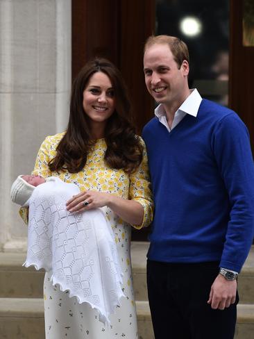 Britain's Prince William, Duke of Cambridge, and his wife Catherine, Duchess of Cambridge show their newly-born daughter, their second child, to the media outside the Lindo Wing at St Mary's Hospital in central London, on May 2, 2015. The Duchess of Cambridge was safely delivered of a daughter weighing 8lbs 3oz, Kensington Palace announced. The newly-born Princess of Cambridge is fourth in line to the British throne. AFP PHOTO / LEON NEAL