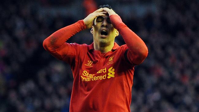 FILE: Uruguay striker Luis Suarez has been suspended for four months, for biting Italy defender Giorgio Chiellini. LIVERPOOL, ENGLAND - DECEMBER 01: Luis Suarez of Liverpool reacts during the Barclays Premier League match between Liverpool and Southampton at Anfield on December 1, 2012 in Liverpool, England. (Photo by Chris Brunskill/Getty Images)