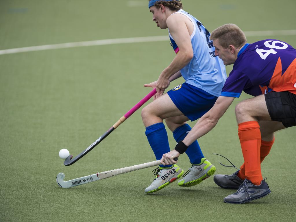 Toowoomba 2 player Oliver Harding (left) and Alexander King of Fraser Coast in Hockey Queensland Championships at Clyde Park, Sunday, May 2, 2021. Picture: Kevin Farmer